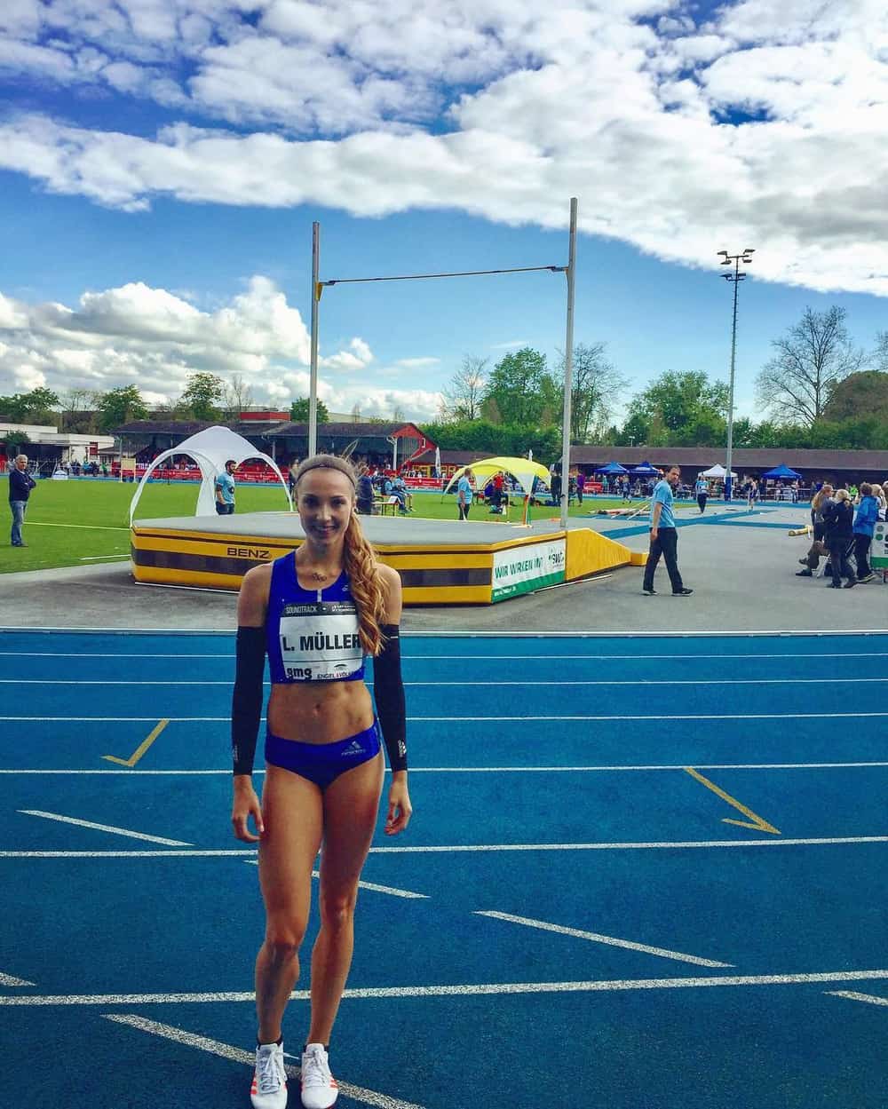 Laura Mueller standing on a track