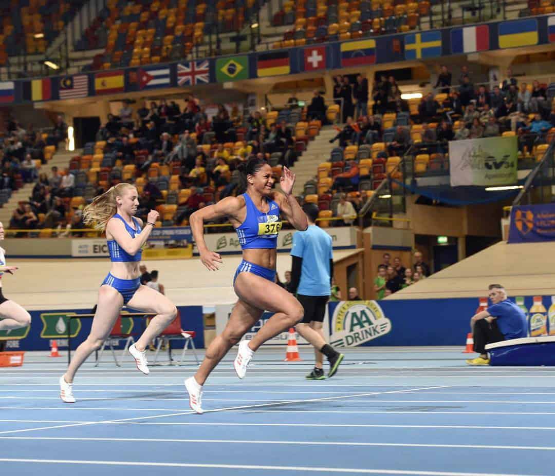 Naomi Sedney sprinting in competition