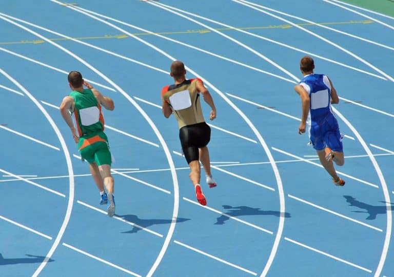 Sprinters running the curve of the 200m