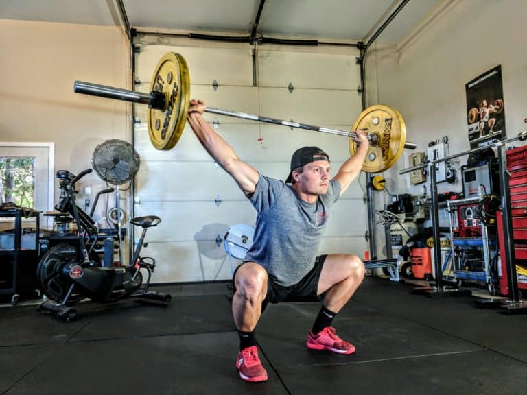 An athlete performing a squat snatch